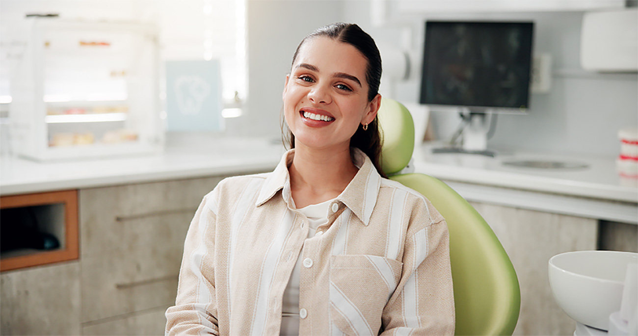 Patient smiling in a bright modern dental treatment room