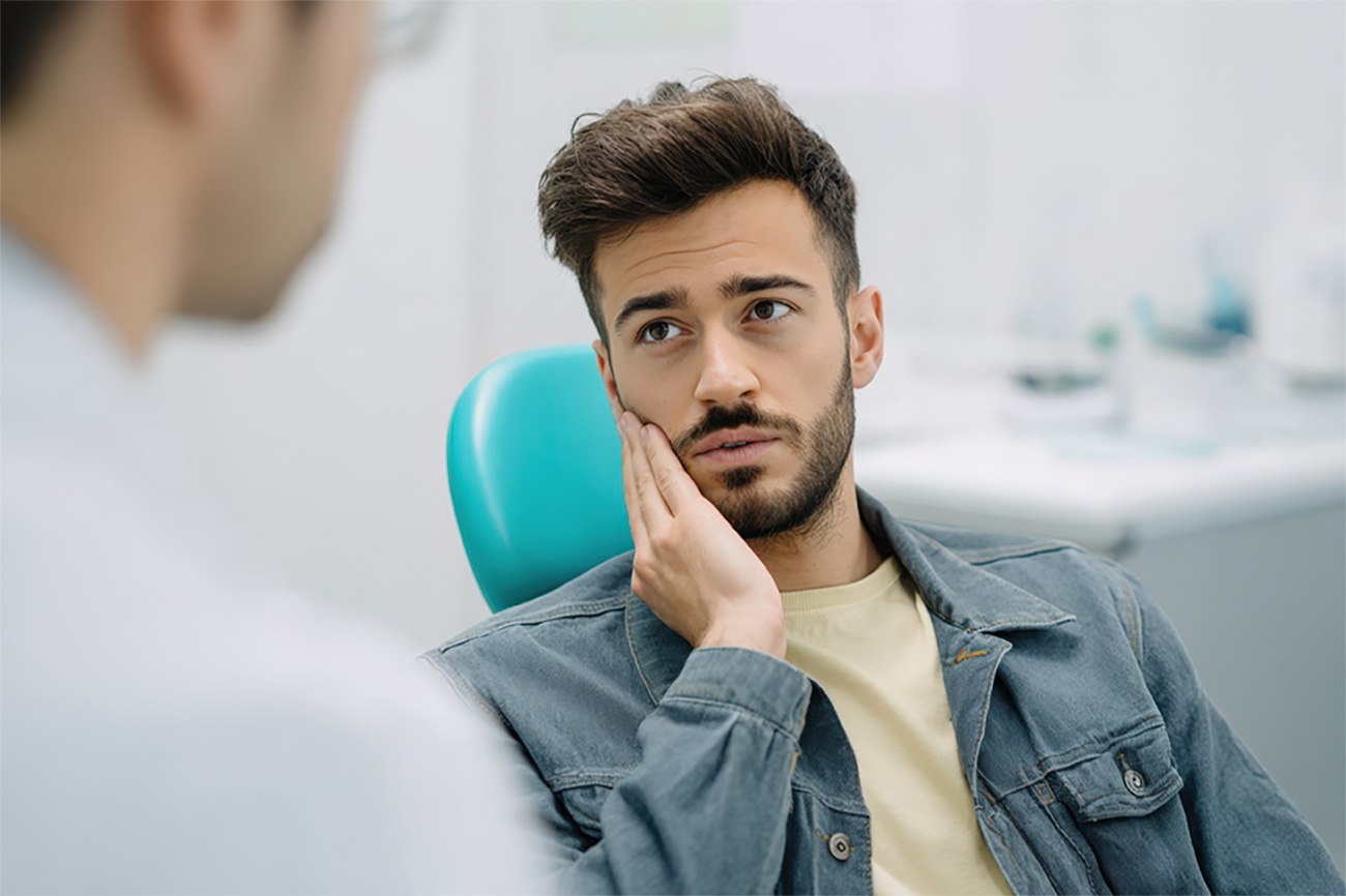 Patient discussing tooth discomfort during a dental visit