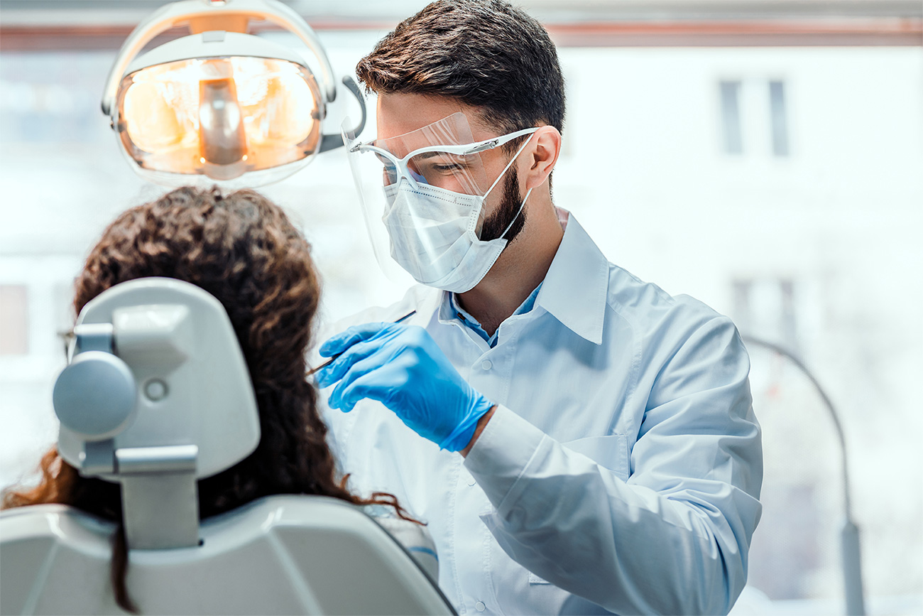 Dentist providing attentive clinical care